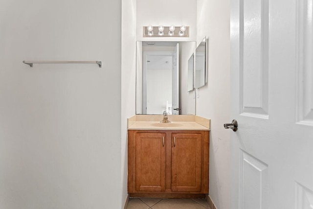 bathroom with tile patterned floors and vanity