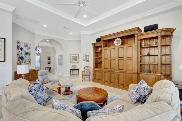 tiled living room with ceiling fan and ornamental molding