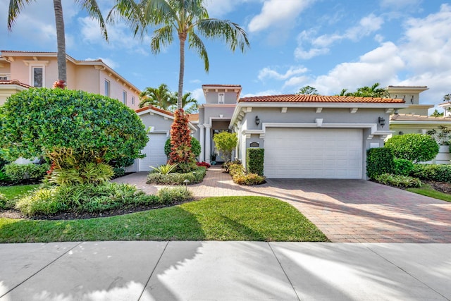 mediterranean / spanish-style home with a garage