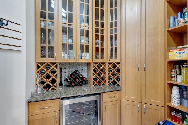 wine room featuring bar and beverage cooler