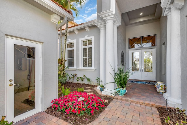 property entrance featuring french doors