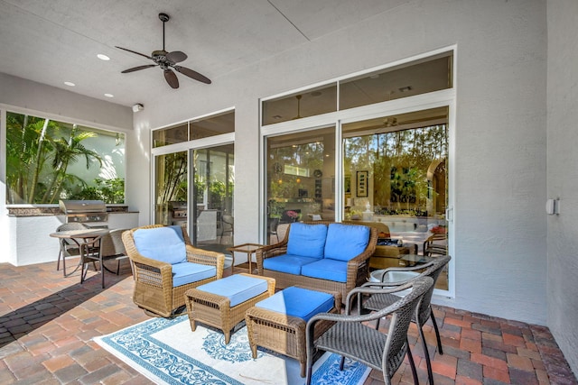 view of patio / terrace featuring area for grilling, ceiling fan, and an outdoor hangout area