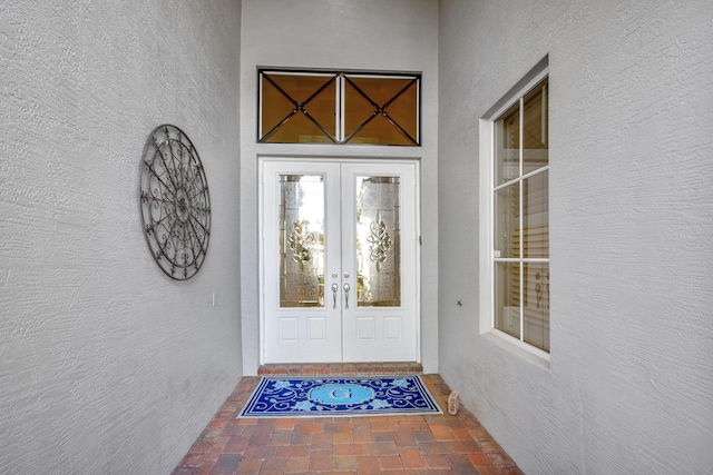 view of exterior entry featuring french doors