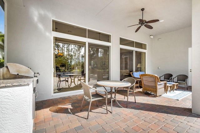 view of patio / terrace with area for grilling and ceiling fan