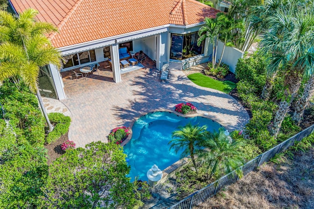 view of swimming pool with a patio