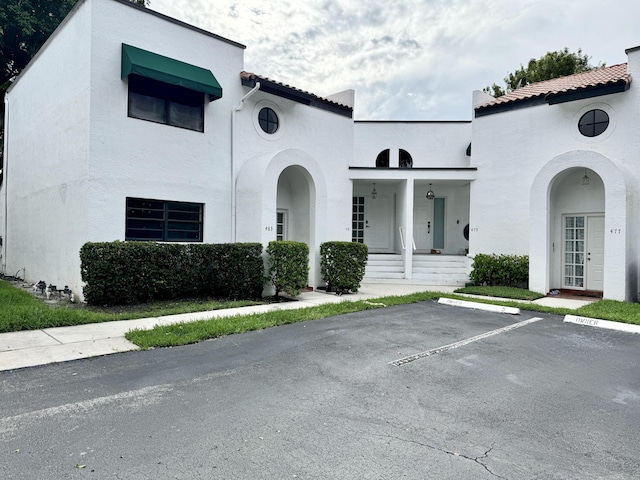 mediterranean / spanish home with covered porch