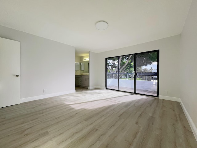 unfurnished room featuring light wood-type flooring