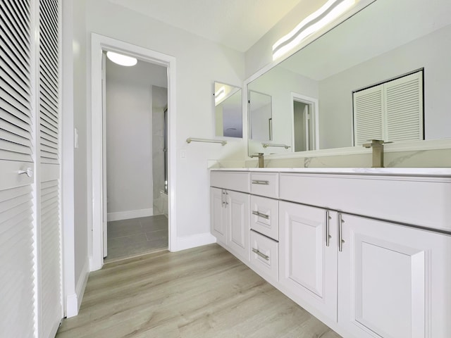 bathroom featuring hardwood / wood-style flooring and vanity