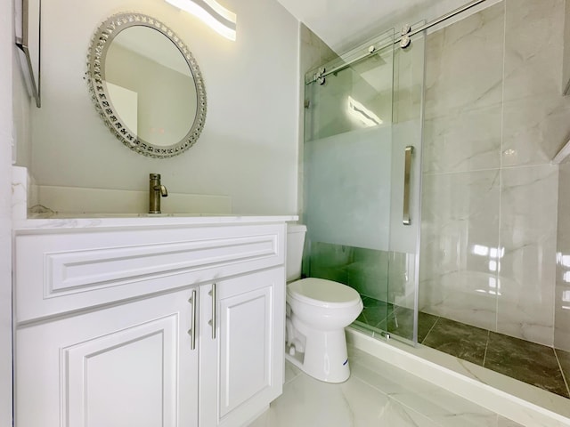 bathroom with vanity, toilet, and walk in shower