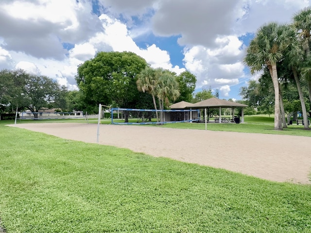 view of home's community featuring volleyball court, a gazebo, and a lawn