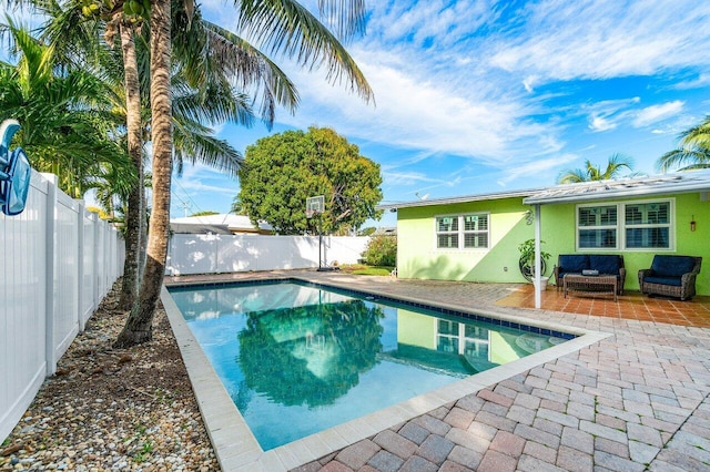 view of swimming pool with a patio area