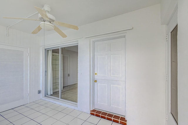 unfurnished sunroom with ceiling fan