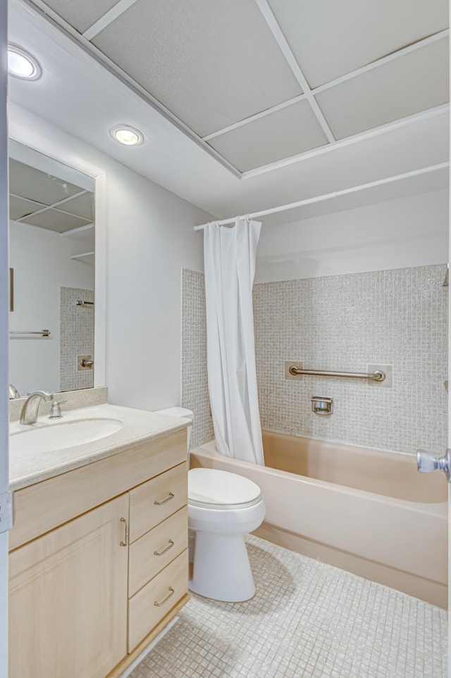 full bathroom featuring vanity, toilet, and shower / bathtub combination with curtain