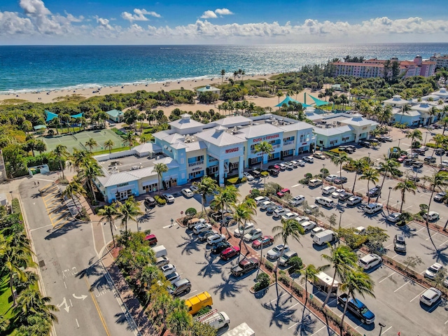 birds eye view of property with a view of the beach and a water view