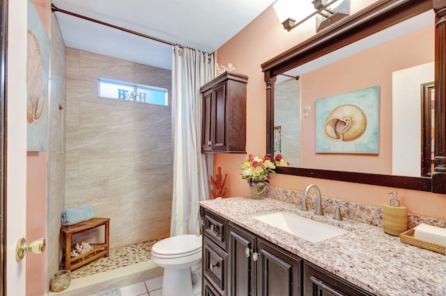 bathroom with tile patterned floors, vanity, walk in shower, and toilet