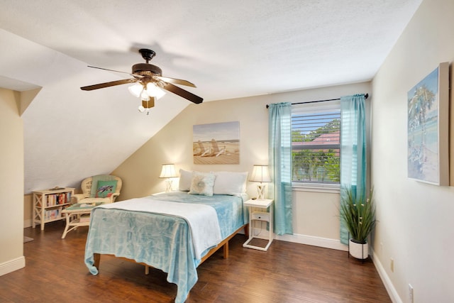 bedroom with ceiling fan, dark hardwood / wood-style flooring, and vaulted ceiling