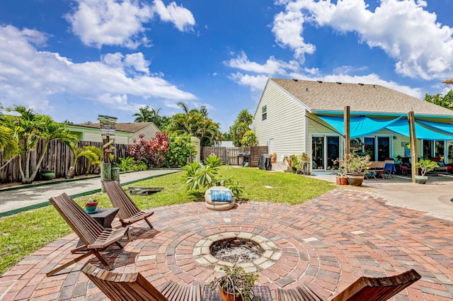 view of patio / terrace with a fire pit