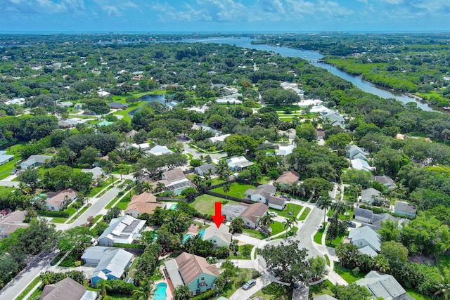 birds eye view of property with a water view