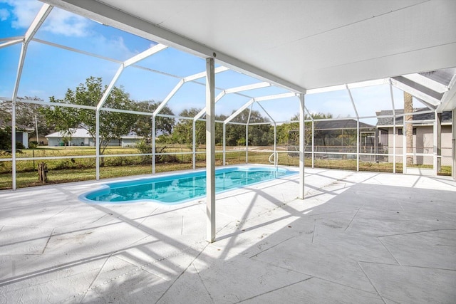 view of pool with a lanai and a patio area