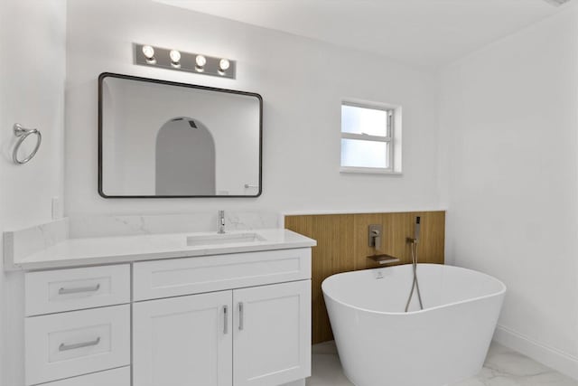 bathroom with vanity and a tub to relax in