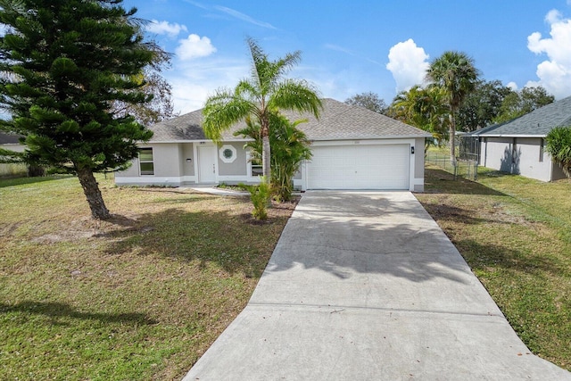 single story home with a garage and a front yard