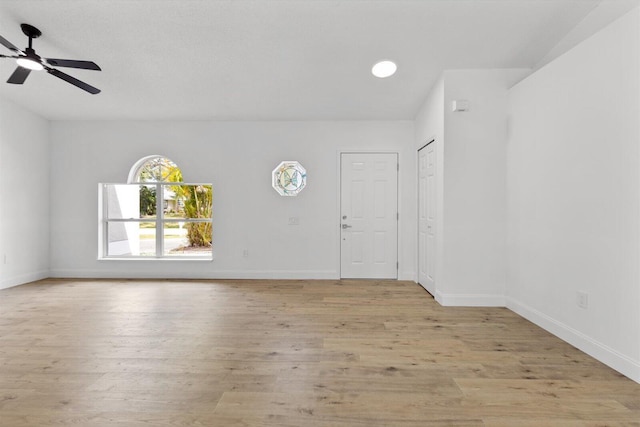 interior space featuring ceiling fan and light wood-type flooring