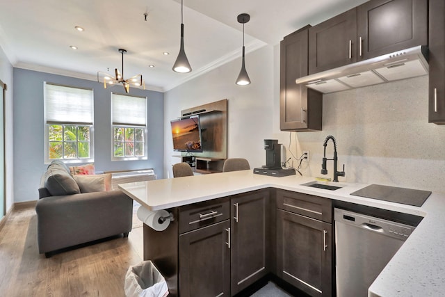 kitchen with kitchen peninsula, stainless steel dishwasher, dark brown cabinetry, sink, and hanging light fixtures