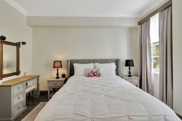 bedroom with hardwood / wood-style flooring and ornamental molding