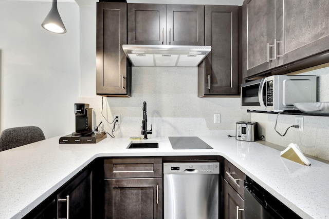 kitchen featuring pendant lighting, dishwasher, sink, decorative backsplash, and dark brown cabinets