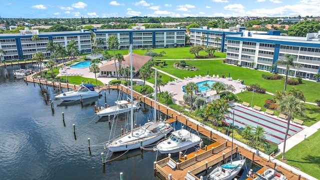 birds eye view of property with a water view