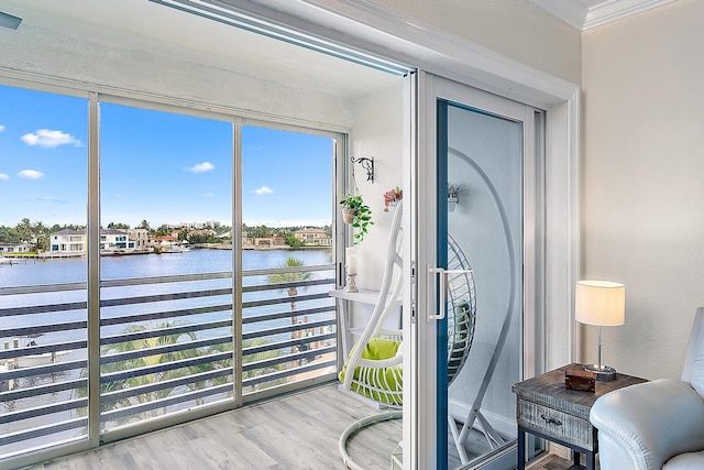 sunroom / solarium with a water view