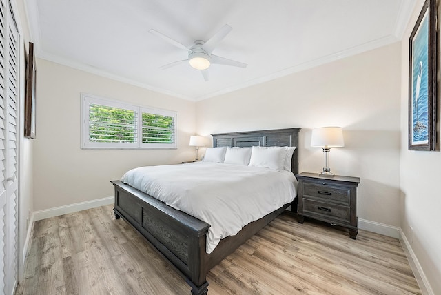 bedroom with ceiling fan, light hardwood / wood-style flooring, and ornamental molding