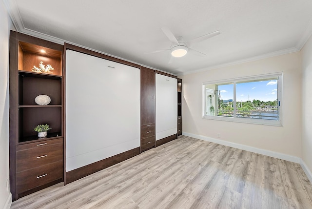 unfurnished bedroom featuring ceiling fan, ornamental molding, and light hardwood / wood-style flooring