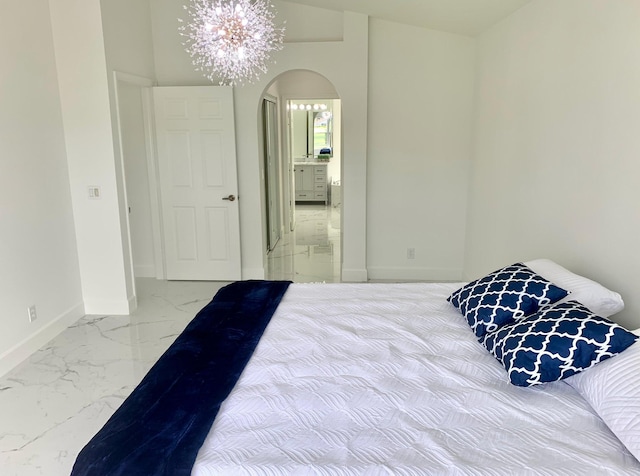 bedroom with a notable chandelier