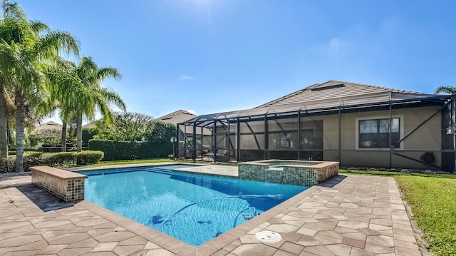 view of swimming pool with a lanai, an in ground hot tub, and a patio