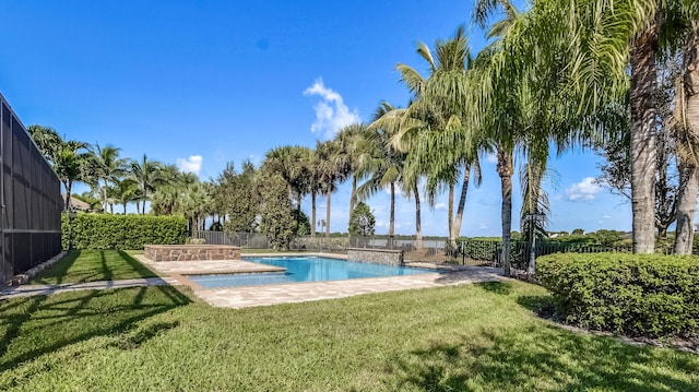 view of pool featuring a yard