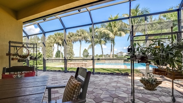 exterior space with a pool with hot tub and a lanai