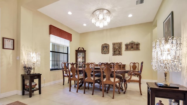 tiled dining space with a chandelier