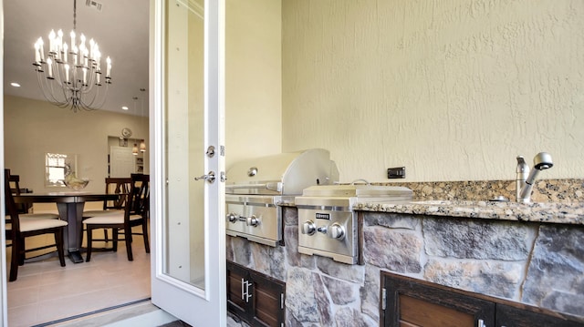 exterior space with sink and a chandelier