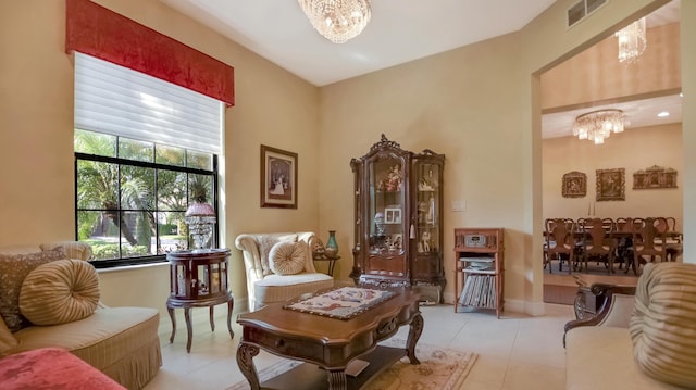 living area with a wealth of natural light, a notable chandelier, and light tile patterned flooring