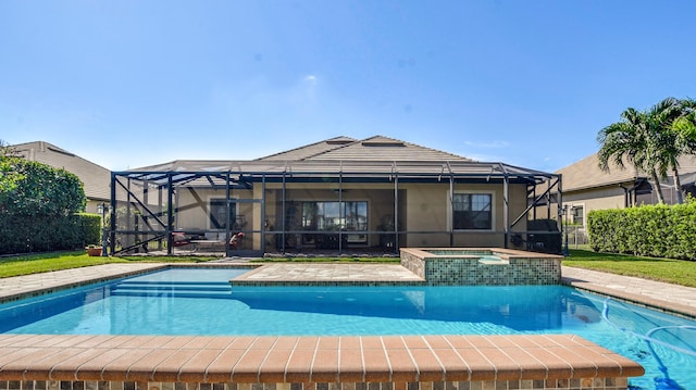 view of pool featuring an in ground hot tub, a patio, and glass enclosure