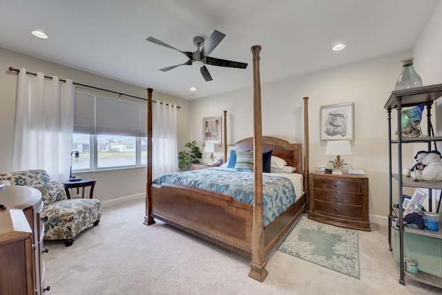 bedroom featuring light colored carpet and ceiling fan