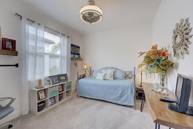 bedroom with light colored carpet