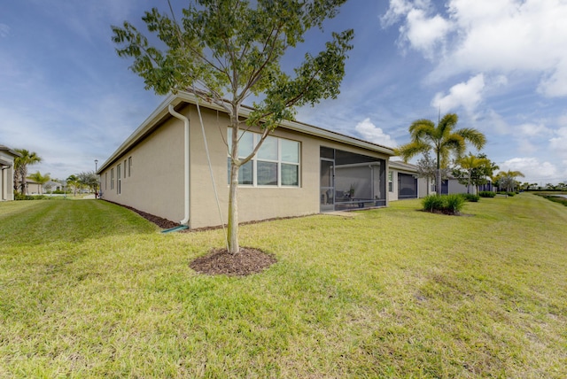 rear view of house with a yard