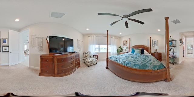 bedroom with lofted ceiling, light colored carpet, and ceiling fan