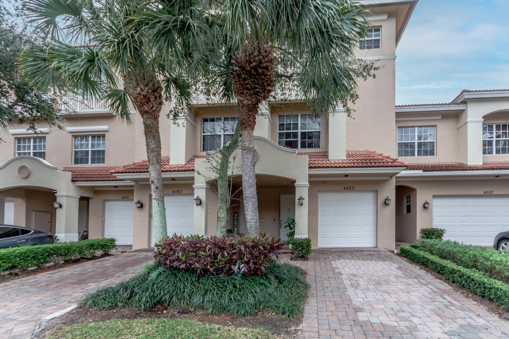 4565 Artesa Way S, Palm Beach Gardens, FL 33418 - view of front of house featuring a garage