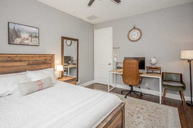 bedroom with ceiling fan and dark wood-type flooring