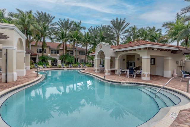 view of swimming pool with a patio area