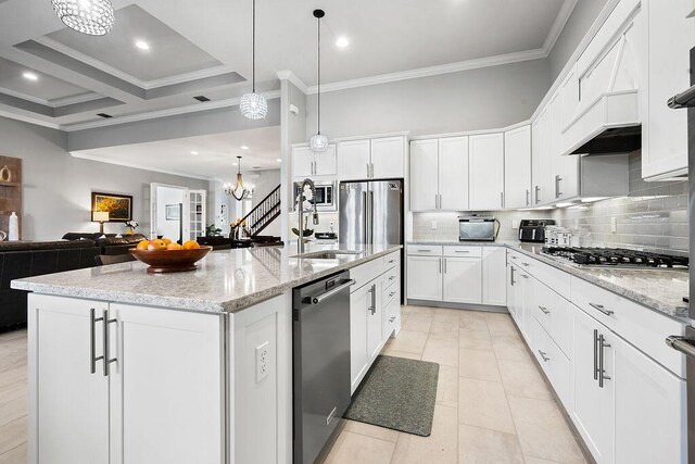 kitchen featuring white cabinetry, a kitchen island with sink, an inviting chandelier, and appliances with stainless steel finishes