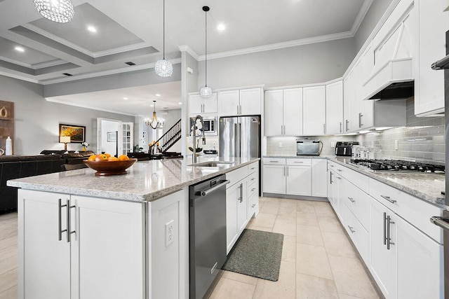 kitchen featuring stainless steel appliances, pendant lighting, a kitchen island with sink, and white cabinetry